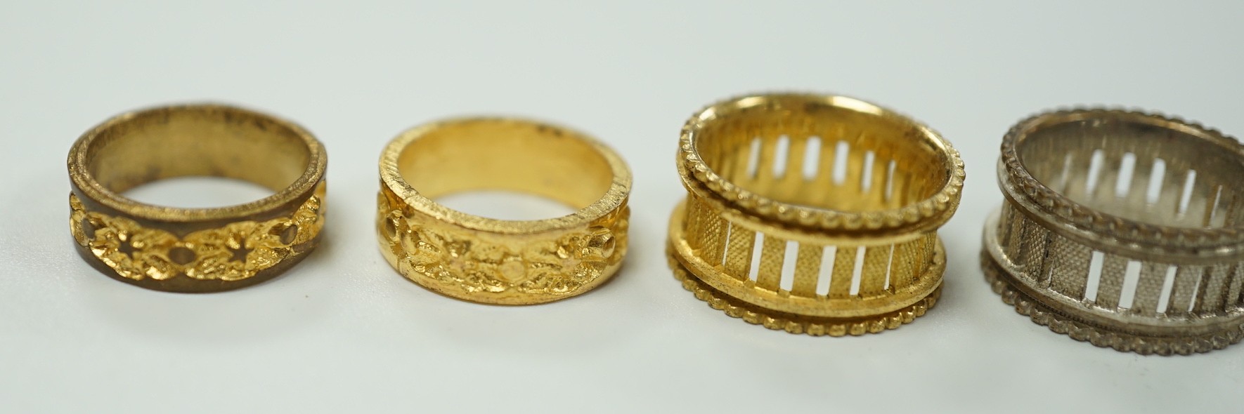 A rare Regency morocco leather mounted white metal cylindrical ring box containing five pinchbeck/base metal sample rings, box length 47mm.